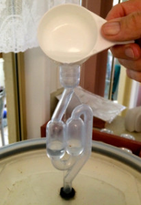 Adding water to the airlock on the barrel