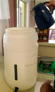 Water being poured into the brewing barrel