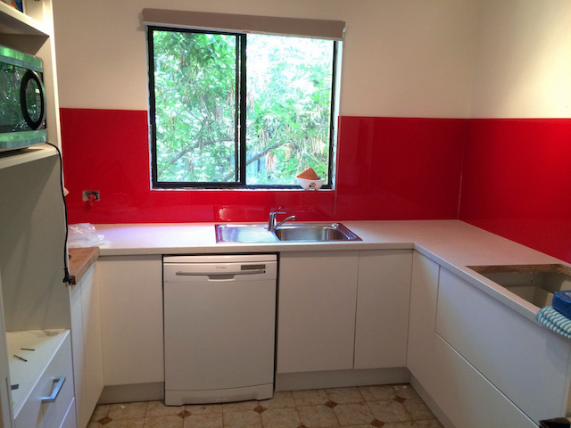 The red splashbacks have been installed